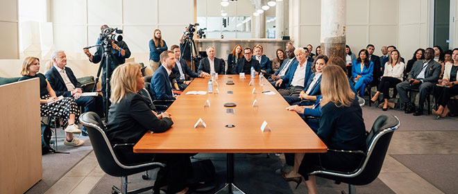 people sitting at a conference table