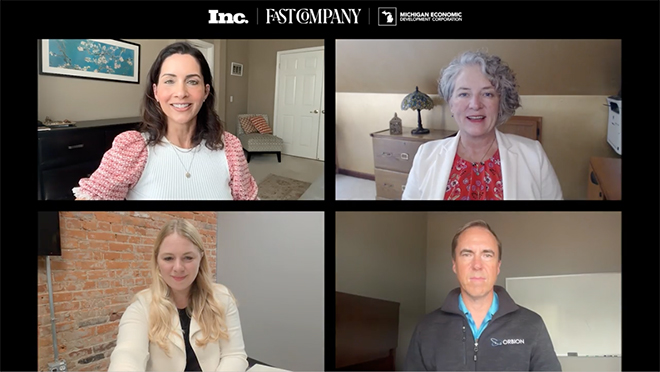 Three women and a man smile on a webinar-style interview.